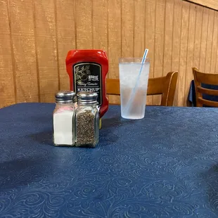a table with salt and pepper shakers