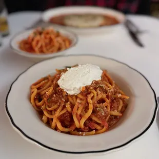 Spicy ragu with bucatini and whipped ricotta