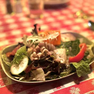 a plate of salad on a table