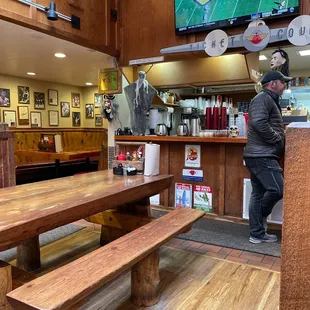 a man standing in front of a television