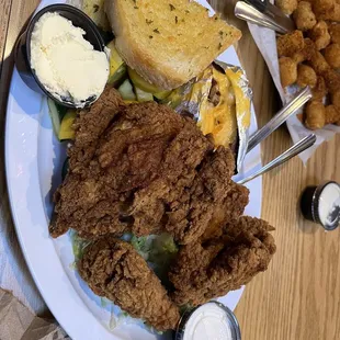 Fried chicken dinner with loaded baked potato. So good and the potato loaded includes bacon and cheese.