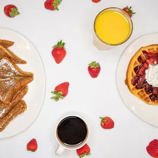 a plate of waffles and a cup of coffee