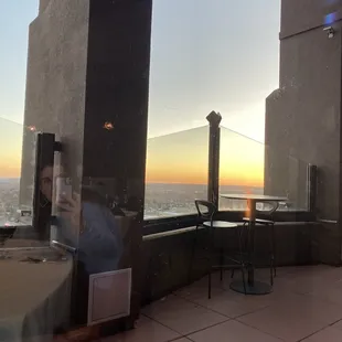 Sunset view from inside. Nice patio seating with fire pit.