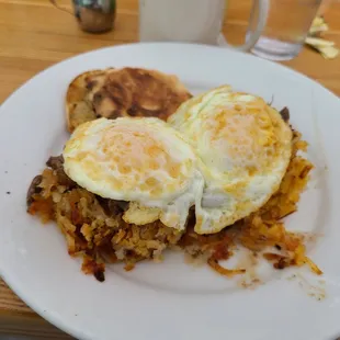 Angus Short Rib &amp; Hash Brown Potato Cakes with Eggs over medium