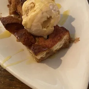 Bread pudding topped with salted caramel ice cream.