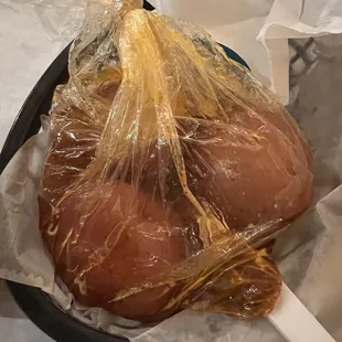 Patatoes in a bag in some liquid.