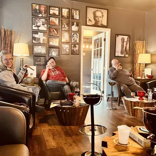a group of people sitting in a living room