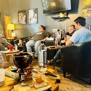 a group of people sitting in a living room