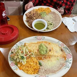 two plates of mexican food on a table