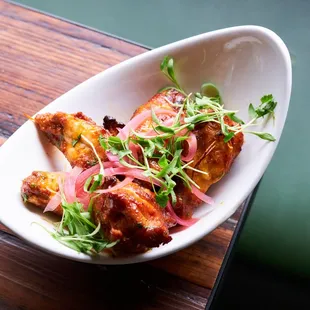 a plate of food on a wooden table