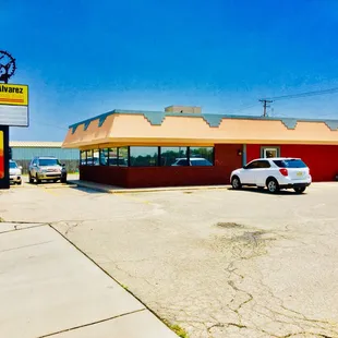 a car parked in front of a restaurant