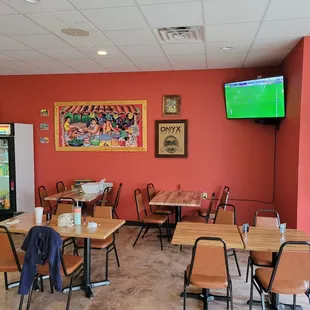 Large eating area and TV screens. Very clean eating and food preparation areas.