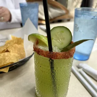 Cucumber margarita and chips with salsa