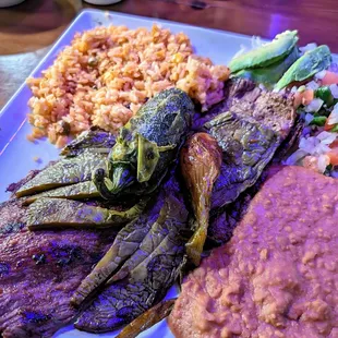 Carne asada (has grilled jalapeno and nopales, refried beans, and Spanish rice)