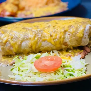 Chile Verde Super Burrito smothered with cheese and verde sauce.