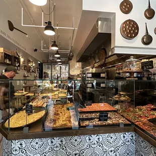 a variety of pizzas on display