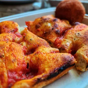 a slice of pizza on a plate