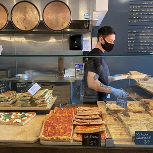 Counter service and 3 copper pans for making Farinata, I think...