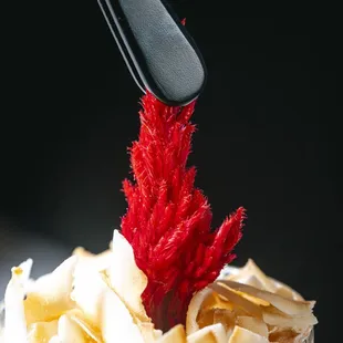 a dessert in a glass with a spoon sticking out of it