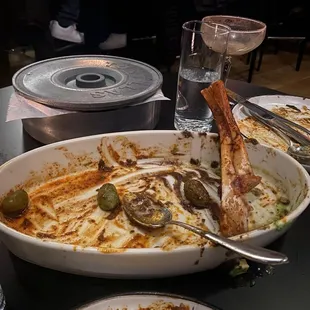 This is what's left over of the lamb shank. Slow cooked in banana leaves. I want to lick the damn plate but people would stare.