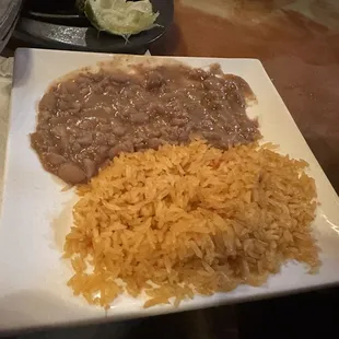 Side dish of frijoles and rice - comes Carne Asada dish