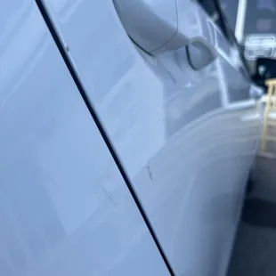 At body shop, he claimed it was tape so i asked him to try and take it off and it didn't come off