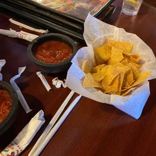 tortillas and salsas on a table