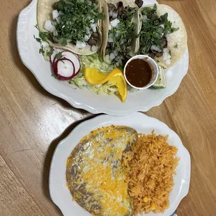 Steak tacos with a side of rice and beans