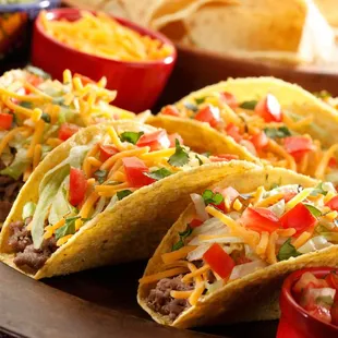 a plate of tacos and salsa