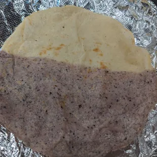 Corn tortilla: half white, half blue. Fluffy and soft, almost like flour tortillas but better.