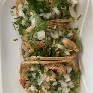 Chicken tacos with cilantro and onion