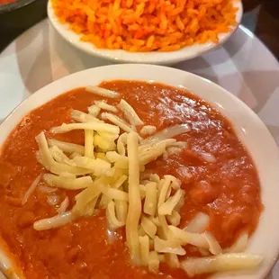 a bowl of chili and cheese