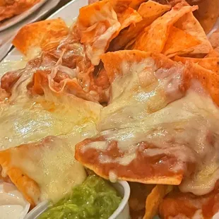 a plate of nachos and guacamole