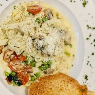 a plate of pasta and bread