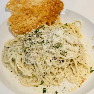 a plate of spaghetti and bread