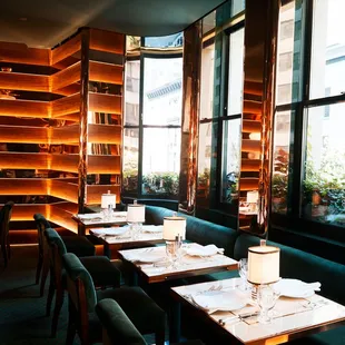 a dining room with a view of the city