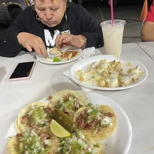 a woman eating at a table