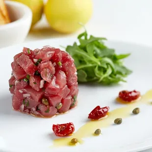 a tuna tartare on a white plate