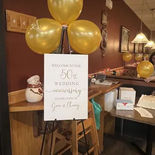 a welcome sign with balloons