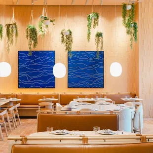 a dining room with tables and chairs