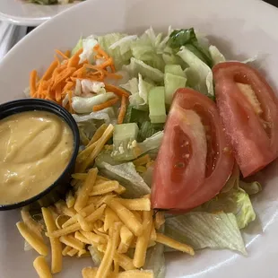 a plate of salad with dressing