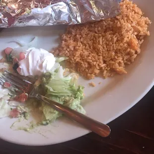 Chicken fajitas with onions and peppers, sided with charro beans and Mexican rice.