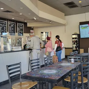 a group of people in a cafe