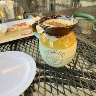 a cup of cappuccino on a table