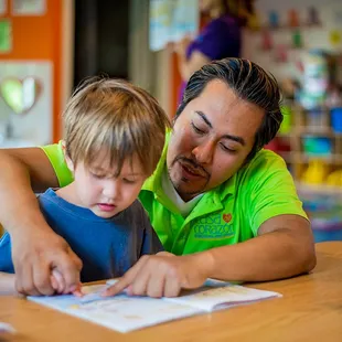 Child interacting with teacher.