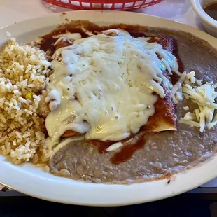 Three enchiladas plate with rice and refried beans