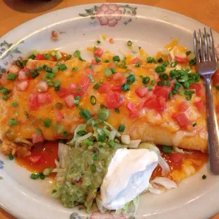 a plate of enchiladas and guacamole