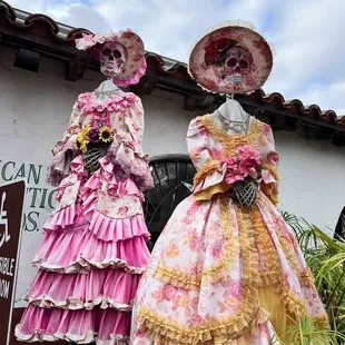 two mannequins dressed in pink and yellow