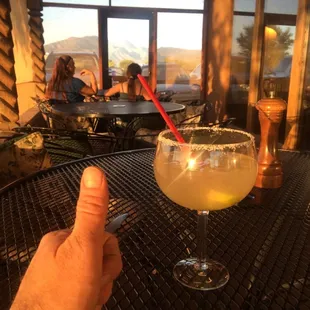 I am having a nice margarita with a repeat order of my beef brisket, beans, and coleslaw.