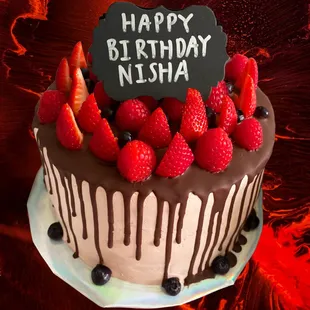 Vegan chocolate cake with chocolate filling &amp; drip with strawberries &amp; raspberries